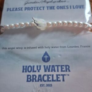 Pearl Bracelet with White Wing Charm